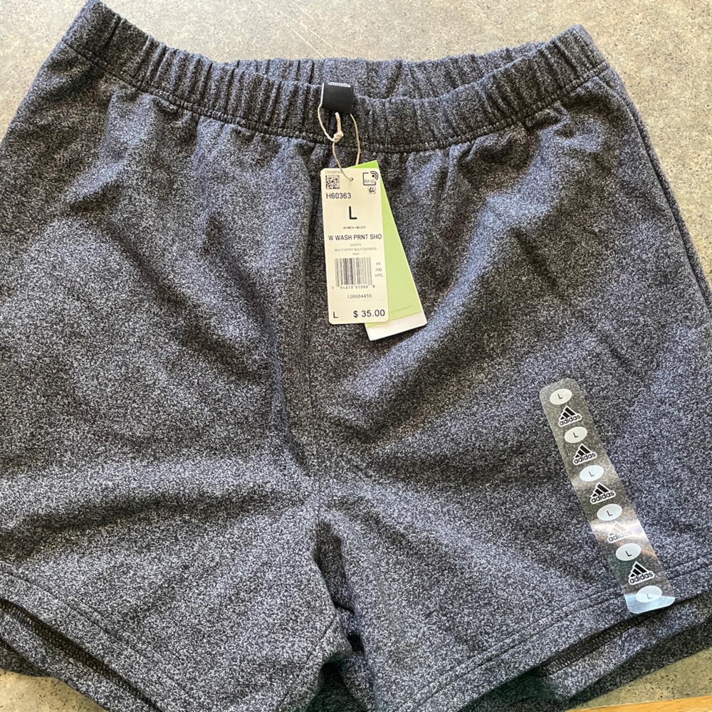 Two pairs of identical Adidas Women’s shorts